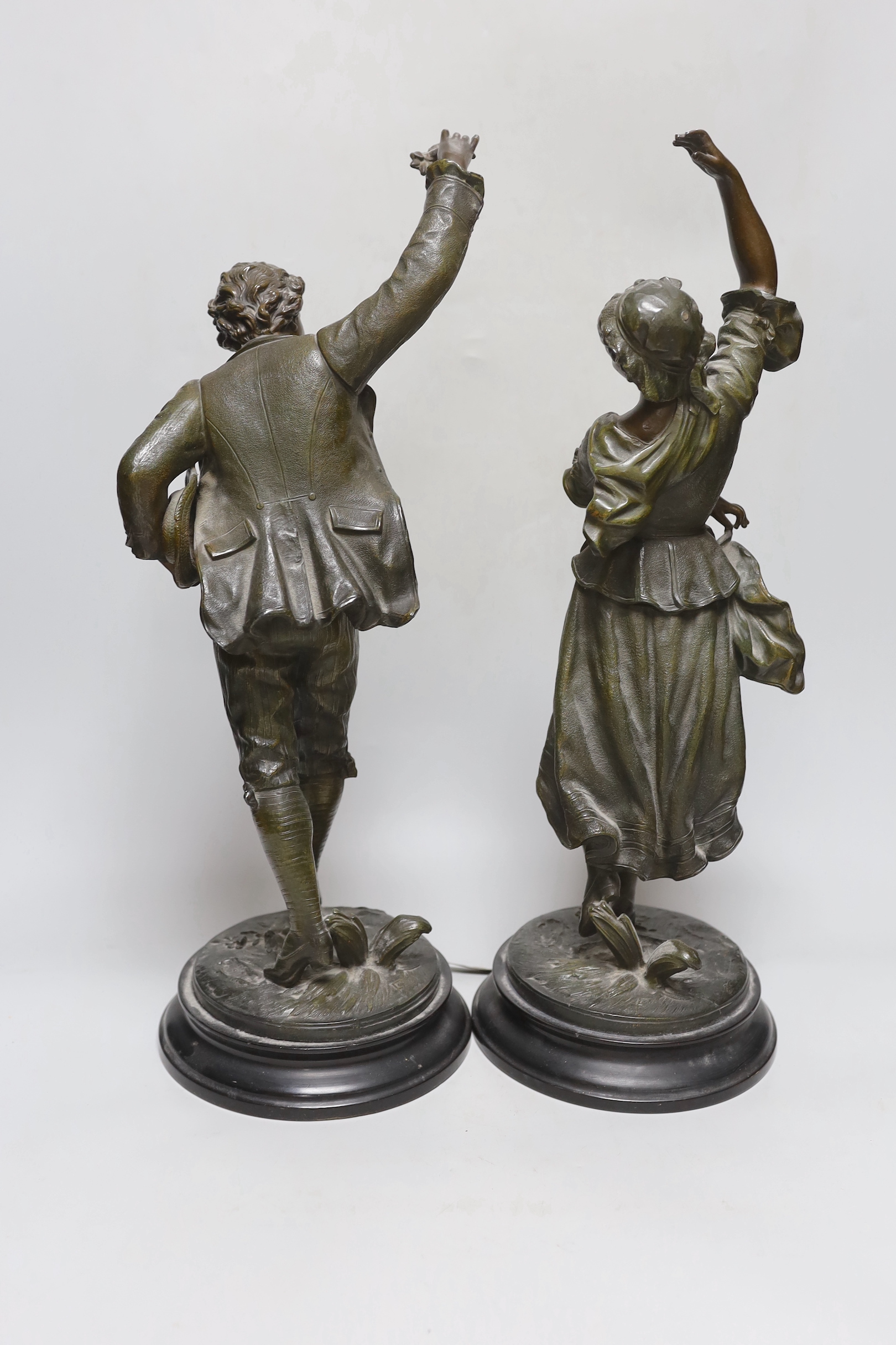 A pair of late 19th century spelter ‘dancing’ figures, tallest 49cm